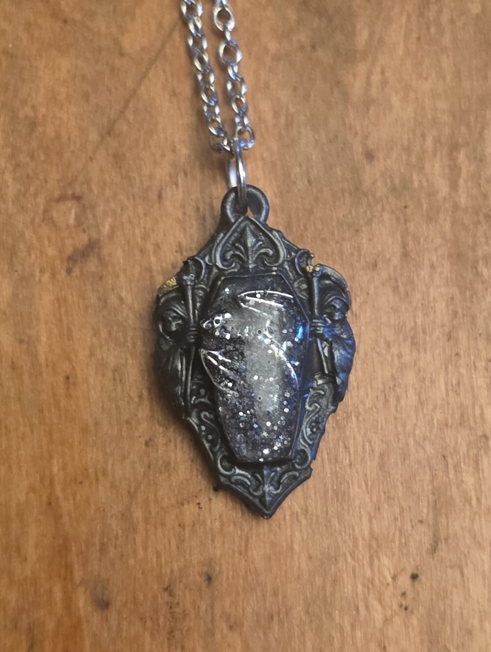 Coffin Shaped Nexjlace With Silver Dragon Under Glitter On Silver Tone Chain